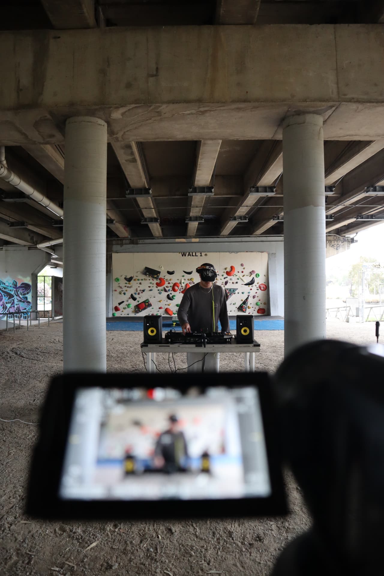 Filming a DJ set under a bridge
