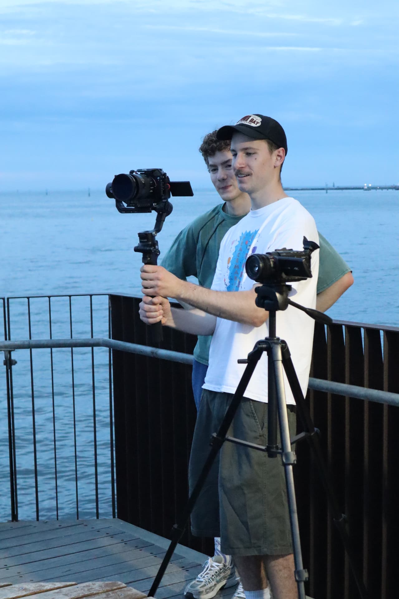 Filming a set on the pier at dusk